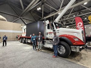crest precast concrete employees standing next to Crest Precast truck
